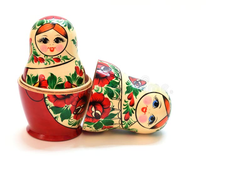 One Assembled Nesting Doll Inside Another Large One and a Head Lying