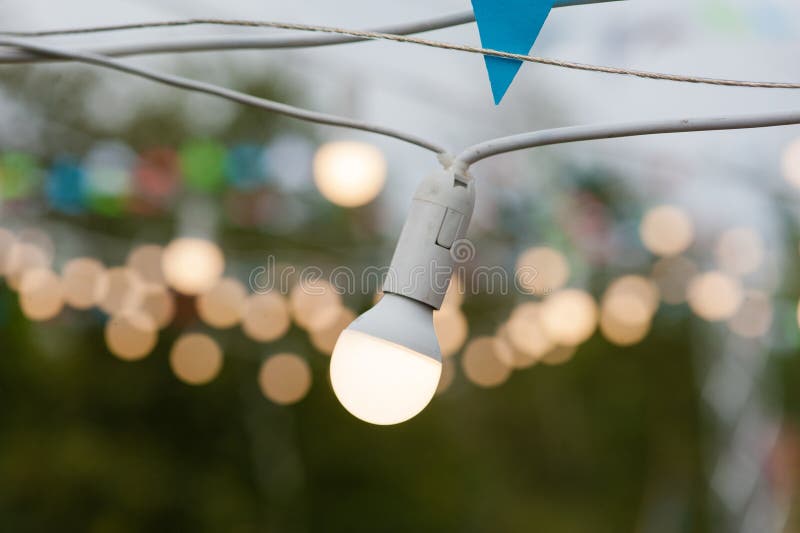 One bulb and bokeh of other garland stock photos One bulb and bokeh of other garland stock photos