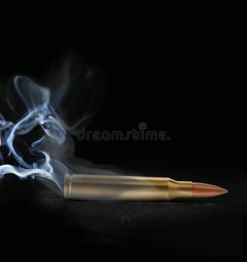 One bullet with smoke on black background royalty free stock image