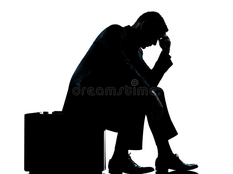 One business man sitting on suitcase silhouette