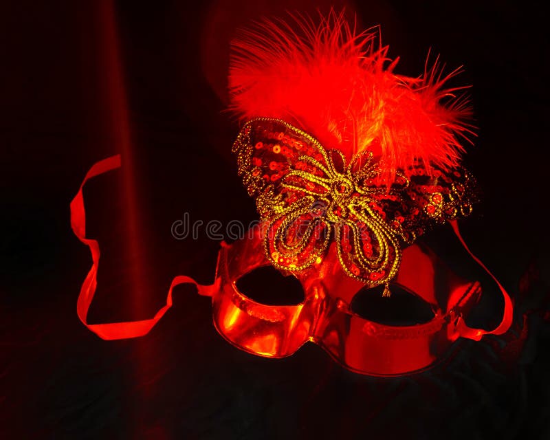 one carnival Venetian red mask on a black background. the Brazilian carnival is a celebration of masks and dancing. stock photos one carnival Venetian red mask on a black background. the Brazilian carnival is a celebration of masks and dancing. stock photos