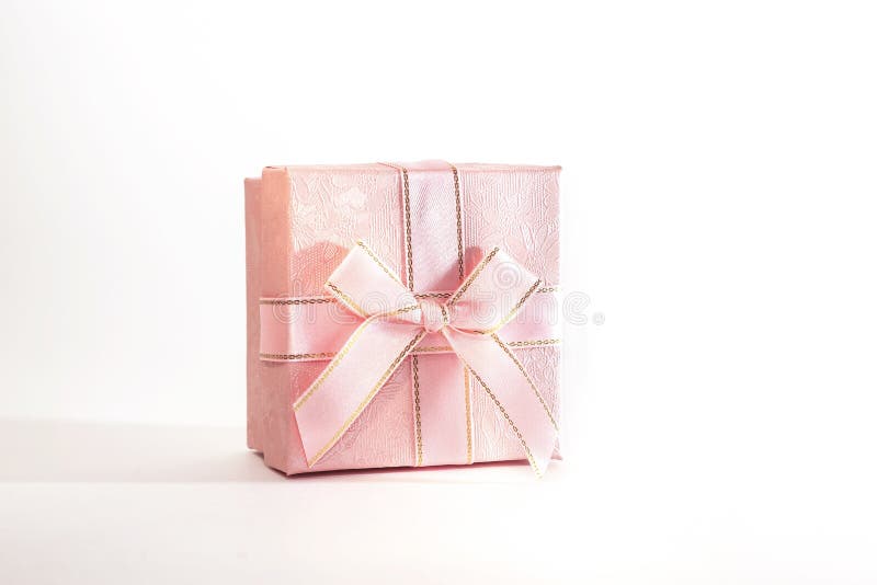One decorative holiday gift box with ribbon bow for congratulations, surprise, pink present on white background with copy space royalty free stock photos One decorative holiday gift box with ribbon bow for congratulations, surprise, pink present on white background with copy space royalty free stock photos