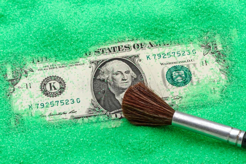 One dollar in green sand stock photo. Image of dollar 113724810