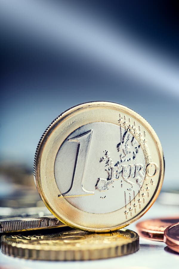 One euro coin on the edge. Euro money currency. Euro coins stacked on each other in different positions