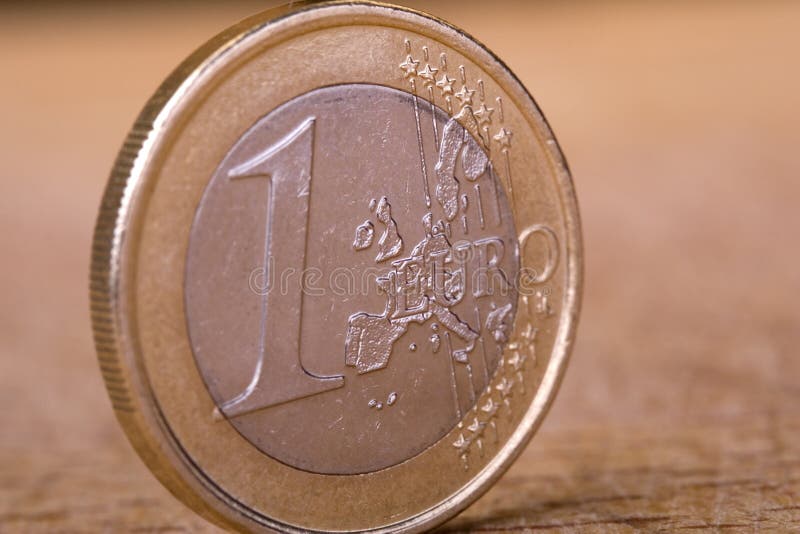 One Euro Coin on Wood