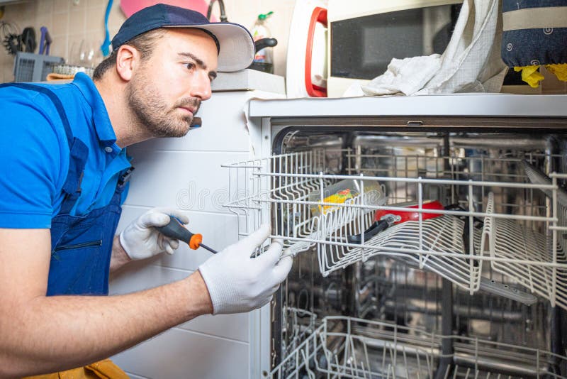 Handyman Fixing Gas Stove in the Kitchen Stock Photo Image of house