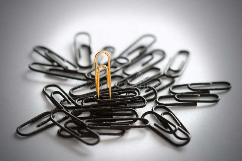 One gold and some black clips royalty free stock images