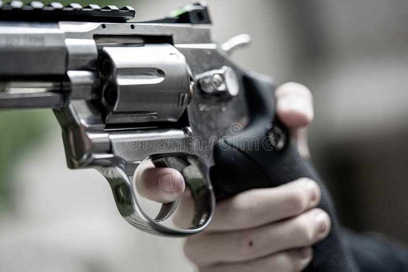 One hand is large silver heavy revolver and aims into the air royalty free stock images One hand is large silver heavy revolver and aims into the air royalty free stock images
