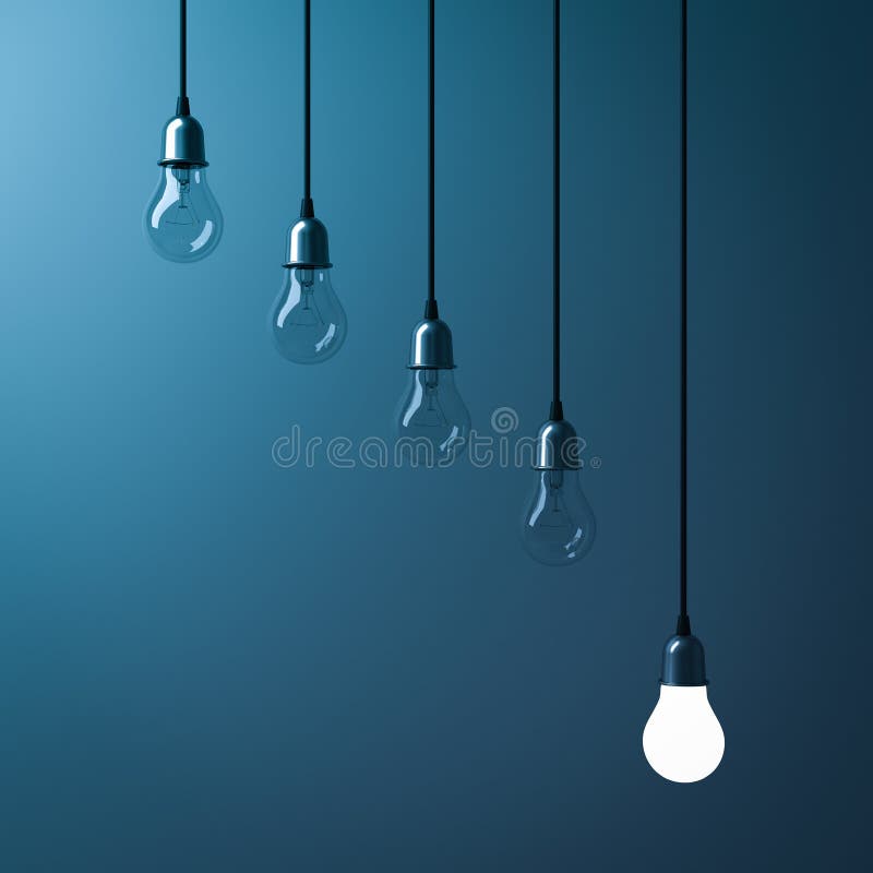 One hanging light bulb glowing different and standing out from unlit incandescent bulbs