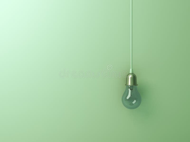 One hanging turn off incandescent light bulb on green wall background