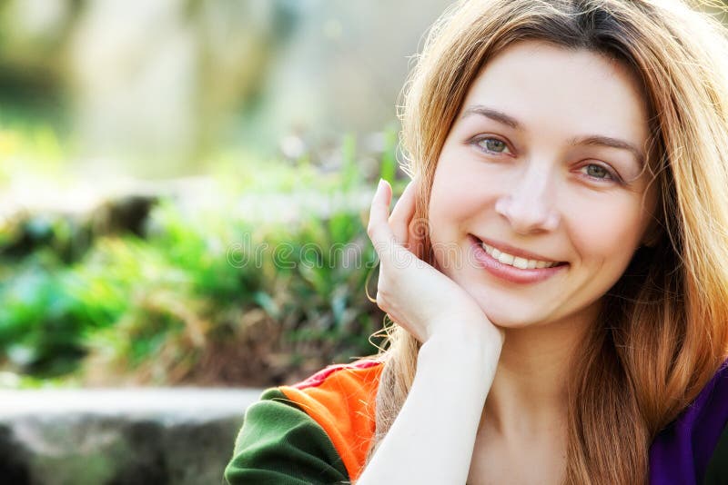 One happy young woman outdoor