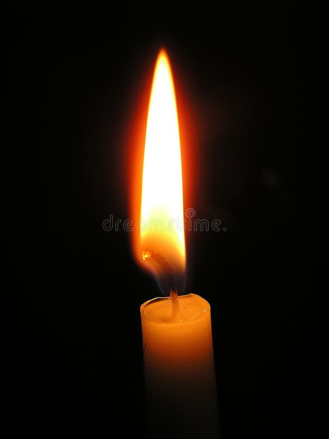 One Light Candle Burning Brightly in the Black Background Stock Image