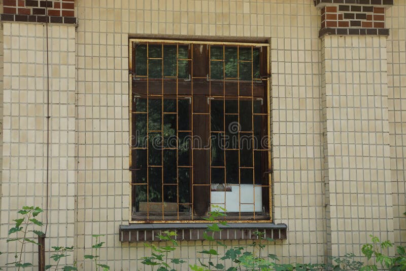 One Old Window Behind an Iron Grate on a Brown Brick Wall Stock Photo Image of exterior