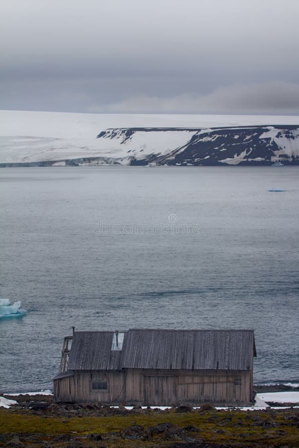 One of oldest polar stations in Arctic. Franz Josef Land. Severe land. One of the oldest polar stations in Arctic founded in 1928, now abandoned. Wooden houses royalty free stock photos One of oldest polar stations in Arctic. Franz Josef Land. Severe land. One of the oldest polar stations in Arctic founded in 1928, now abandoned. Wooden houses royalty free stock photos
