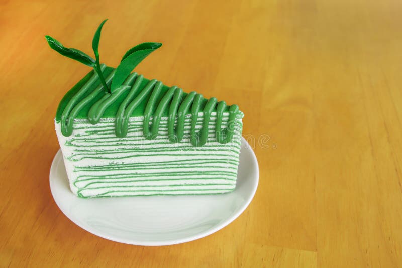 One Piece of Green Tea Flavored Cake on White Circle Plate Stock Image
