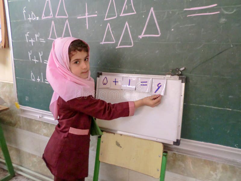 One of the primary school girls in Rasht, Guilan province, Iran. An Islamic school where girls should wear scarves and dress stock images One of the primary school girls in Rasht, Guilan province, Iran. An Islamic school where girls should wear scarves and dress stock images