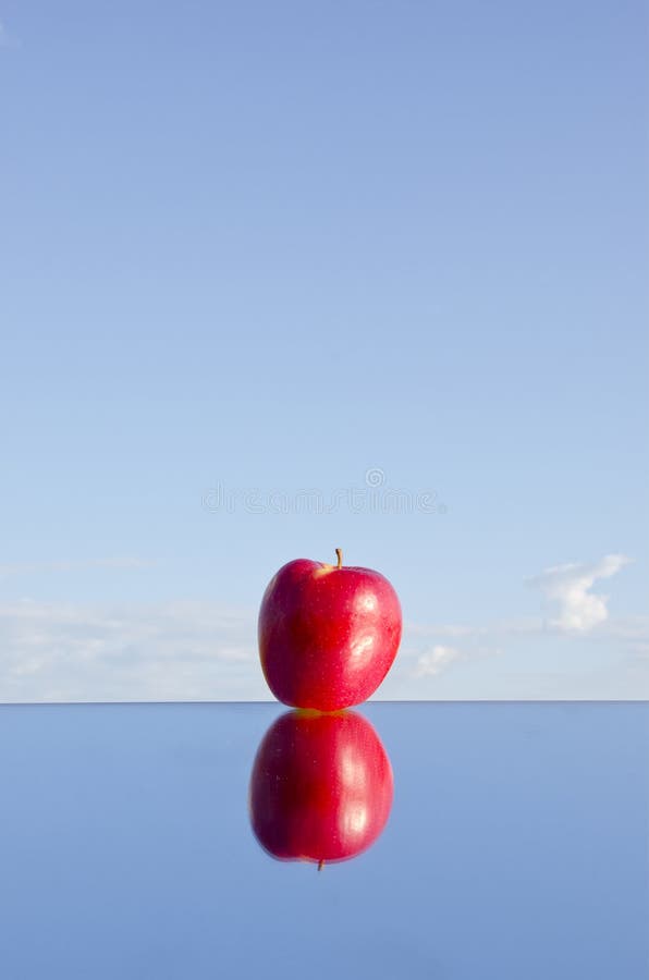 Apple in the mirror image stock photo. Image of brainchild - 36692732