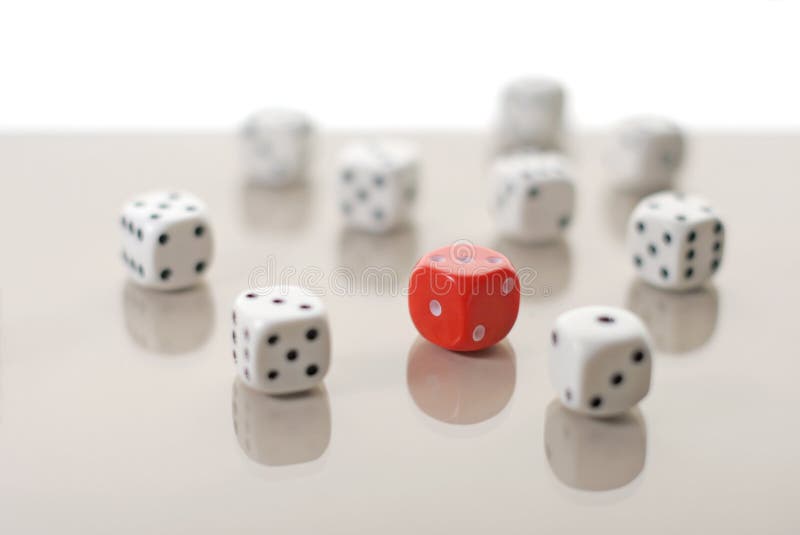 One red dice among white ones