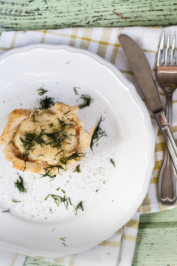 One Serving of Bread Pudding with a Liquid Egg in the Context of Stock