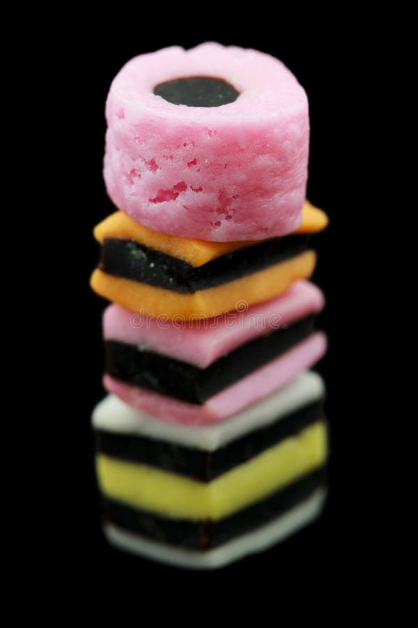 One Stack of Liquorice Allsorts Candy Isolated on Black Background
