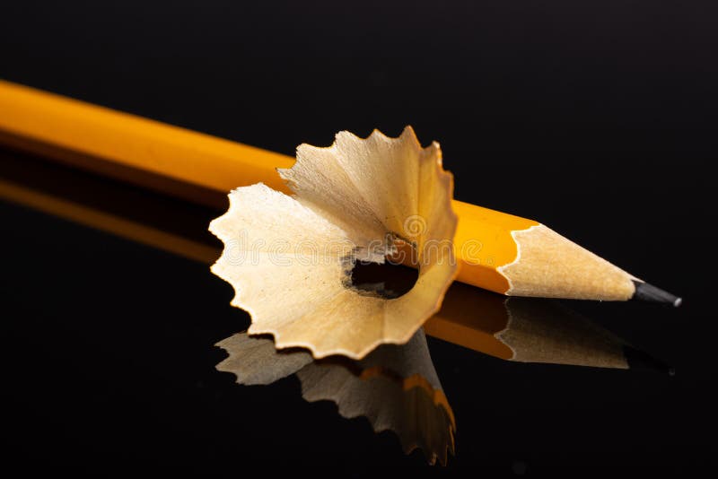 Yellow simple pencil  on black glass