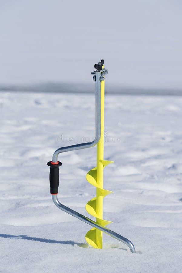 Download One Yellow Ice Drill Auger Stuck In The Snow On A Frozen ...