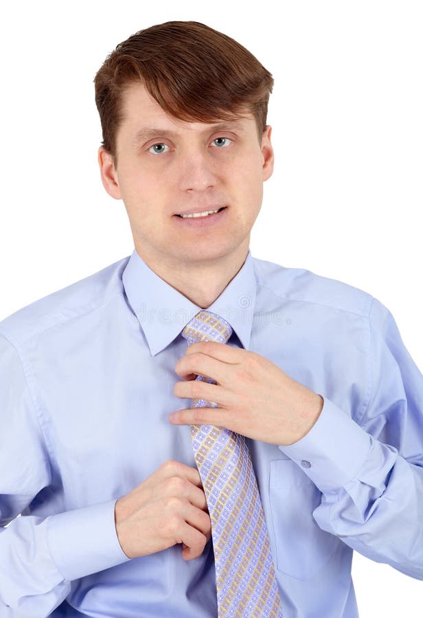 One young man arranges his tie on white