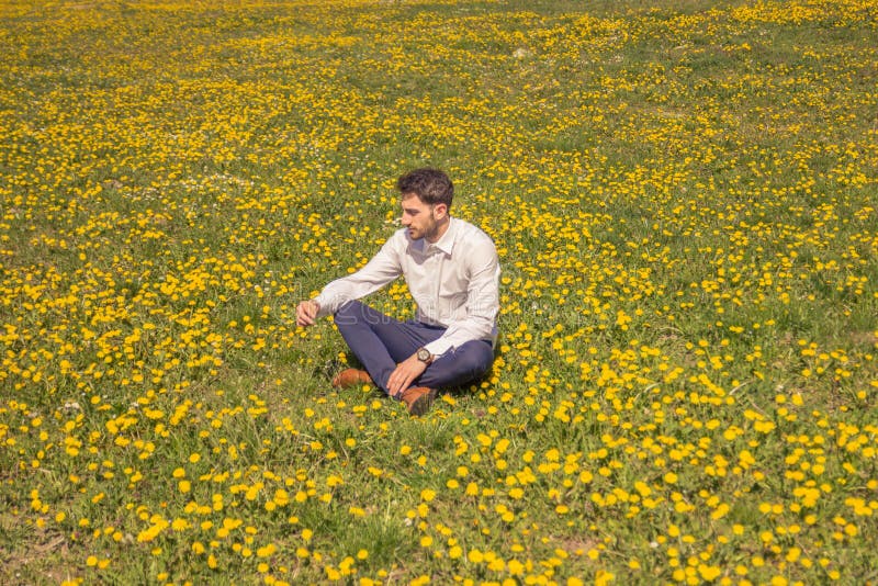 One Young Man Sitting Flower Field Outodoors Sunny Day Stock Photos ...