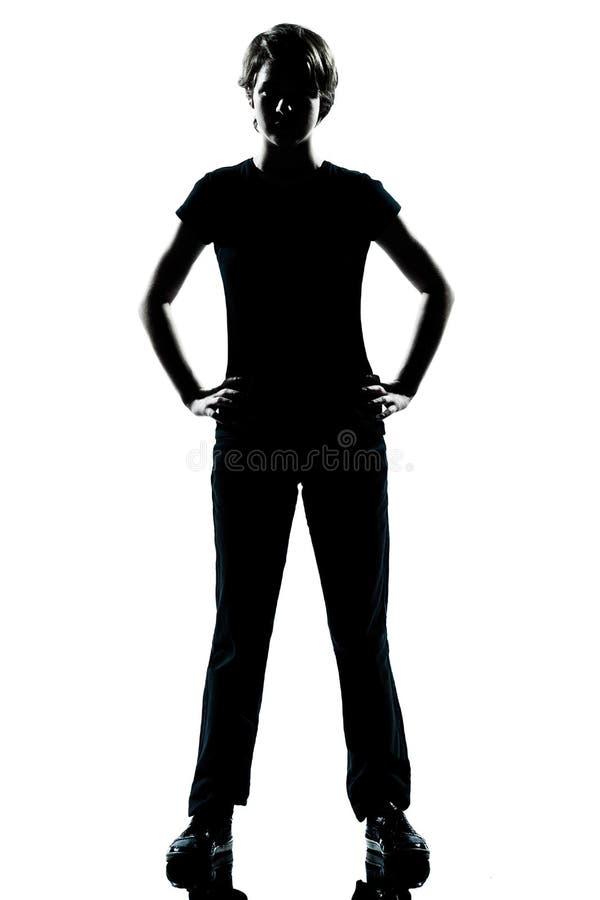 One young teenager boy or girl silhouette standing hands on hips stock photo One young teenager boy or girl silhouette standing hands on hips stock photo