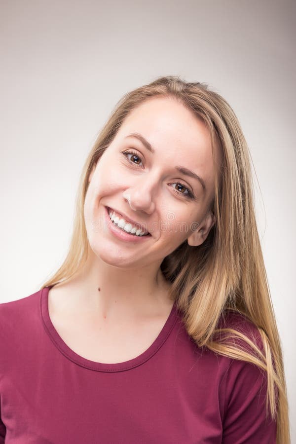 One young woman smiling candid headshot stock photo One young woman smiling candid headshot stock photo
