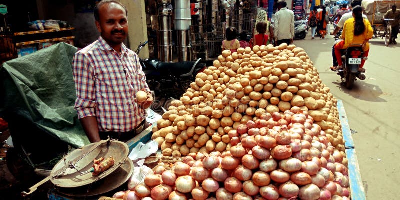 Onion and potato seller at street hand carriage shop royalty free stock image Onion and potato seller at street hand carriage shop royalty free stock image