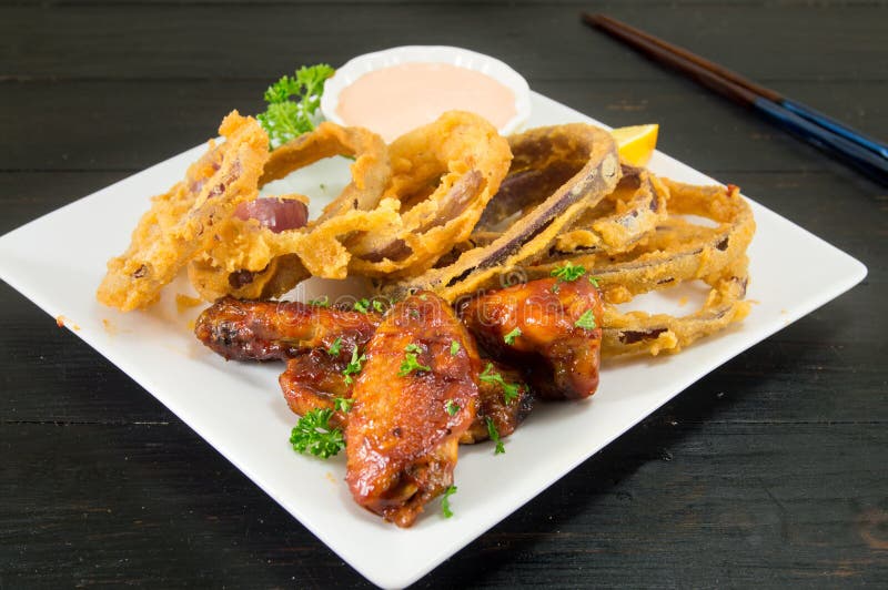 Onion Rings and Barbecue Wings Stock Photo Image of black, plate
