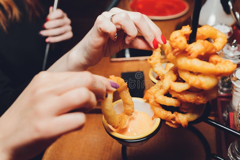 Onion Rings with Ketchup on a Dark Table. Stock Photo Image of