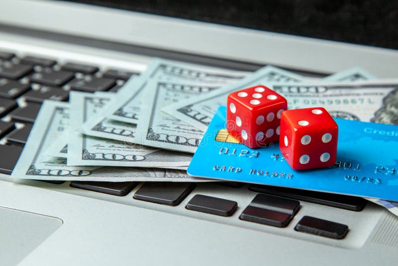 Online Casino, Online Gambling. Money Cash Dollars and Credit Brief with  Dice for Gaming on Laptop Keyboard. Stock Image - Image of addiction,  business: 133441705