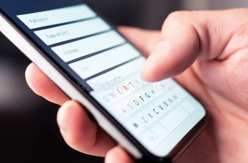 Online form to register personal info and data to web site with mobile phone. Person typing information to internet document stock photography