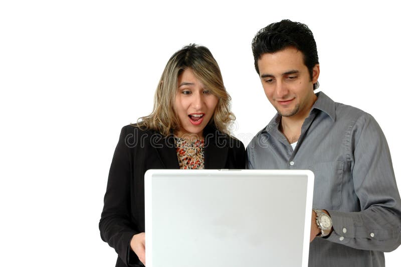 A happy couple shops online or on the internet together. Latino couple searching the internet. Online shopping and making faces. A happy couple shops online or on the internet together. Latino couple searching the internet. Online shopping and making faces.