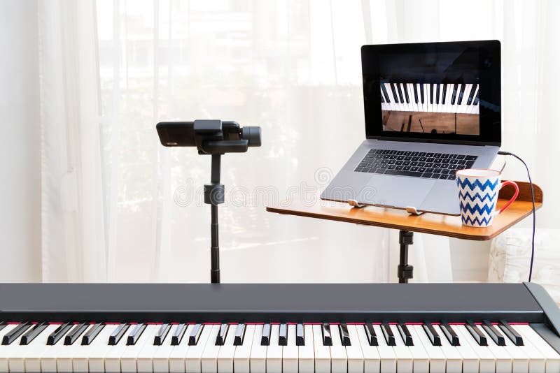 Online Piano Lessosn Setup with a Laptop, a Piano Keyboard and a