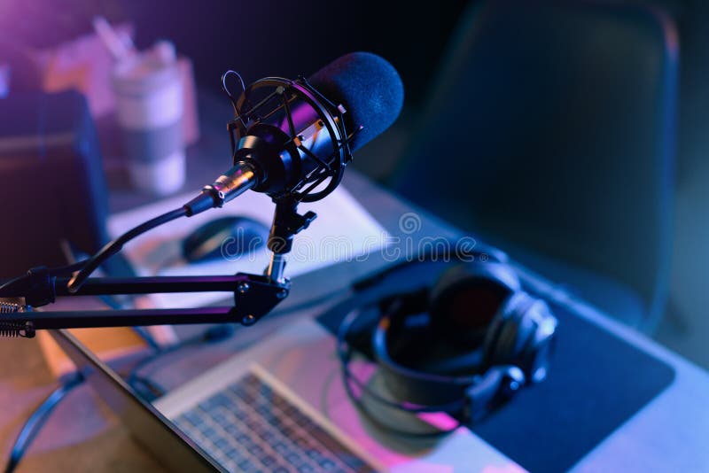 Online live radio studio desk with microphone in the foreground, entertainment and communication concept. Online live radio studio desk with microphone in the foreground, entertainment and communication concept