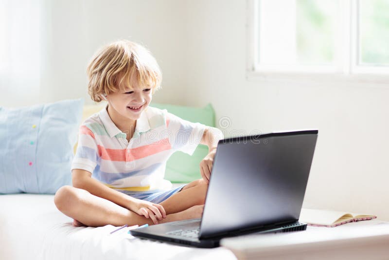 Online remote learning. School kids with computer royalty free stock photography