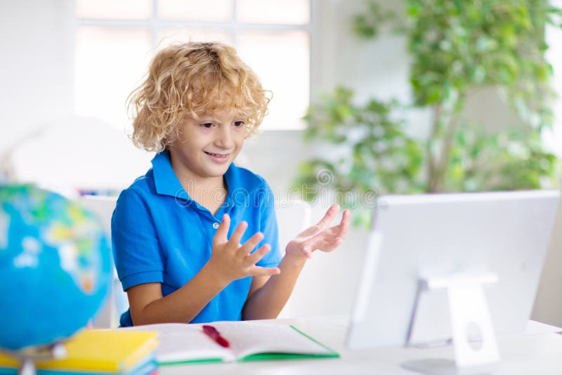 Online remote learning. School kids with computer