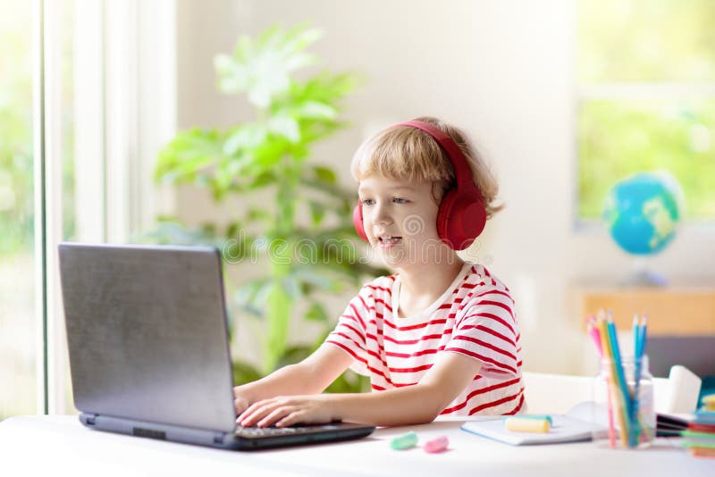 Online remote learning. School kids with computer royalty free stock images