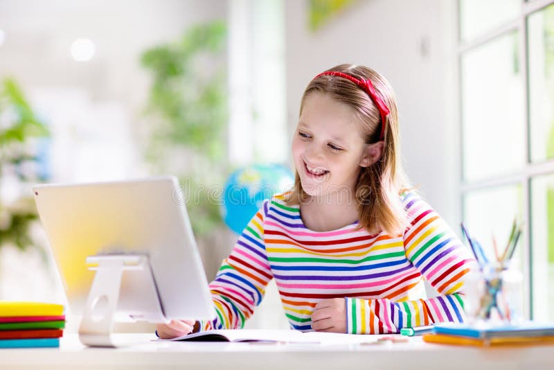 Online remote learning. School kids with computer stock image