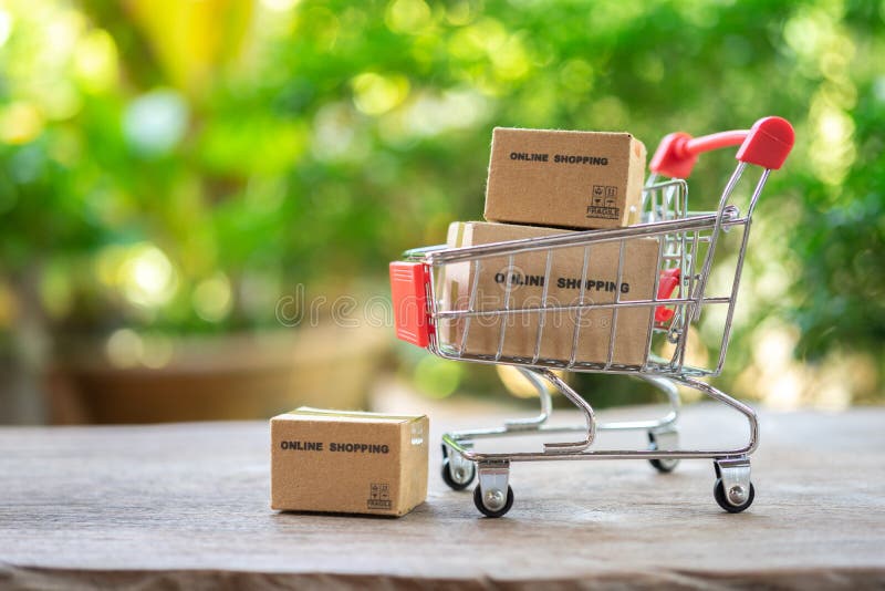 Online shopping with a shopping cart and shopping bags delivery service using as background shopping concept and delivery service