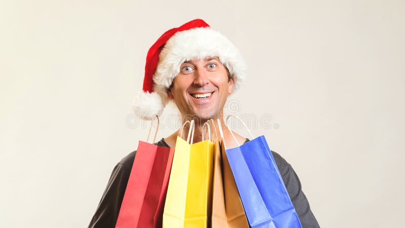 Online shopping christmas. New year gifts. Happy Santa with shopping bags, isolated on white. Copy space. Christmas shopping, royalty free stock images Online shopping christmas. New year gifts. Happy Santa with shopping bags, isolated on white. Copy space. Christmas shopping, royalty free stock images
