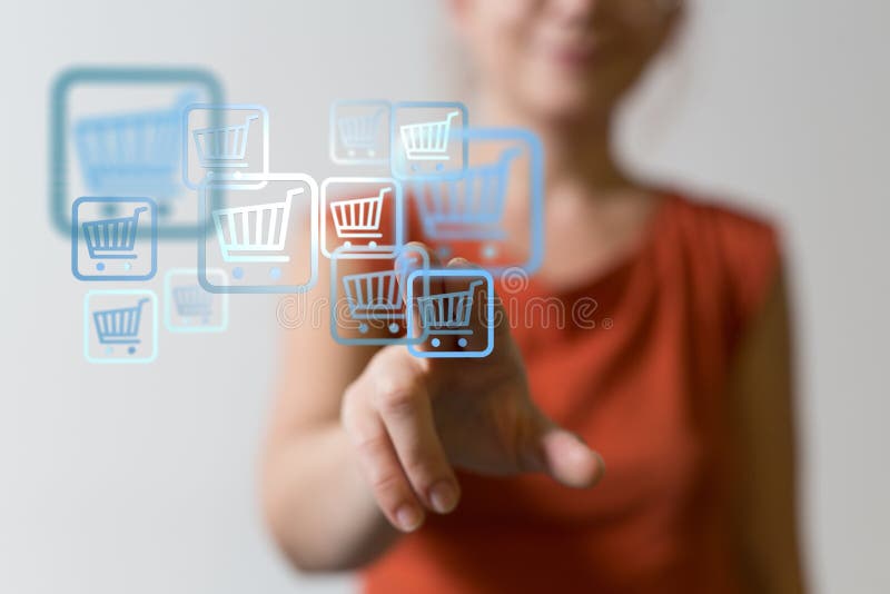 Online shopping concept. Woman clicking on virtual trolley icons to shop online