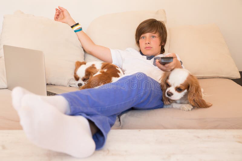 Smiling happy boy watching TV. Smiling happy boy watching TV