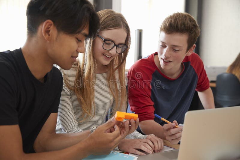 Design Students Working In CAD/3D Printing Lab Together. Design Students Working In CAD/3D Printing Lab Together