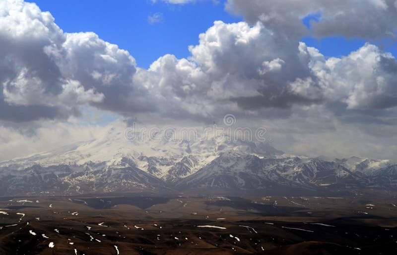 Storm clouds in the mountains of the North Caucasus. View from the plateau Bermutyt. Caucasian ridge, Russia. Storm clouds in the mountains of the North Caucasus. View from the plateau Bermutyt. Caucasian ridge, Russia