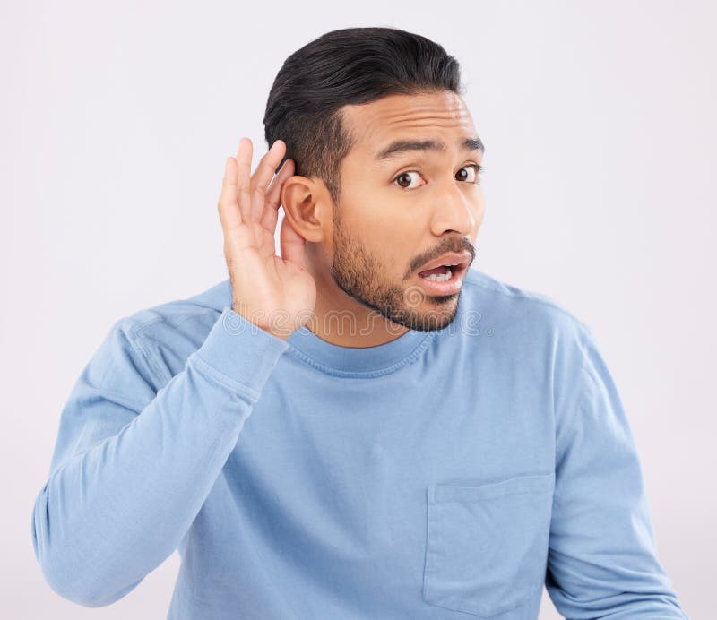 Ear, hands and portrait of asian man with listen, whisper or hearing secret, gossip or news on white background in studio. Confused, what and guy face with emoji for deaf, speak up or volume gesture. Ear, hands and portrait of asian man with listen, whisper or hearing secret, gossip or news on white background in studio. Confused, what and guy face with emoji for deaf, speak up or volume gesture.