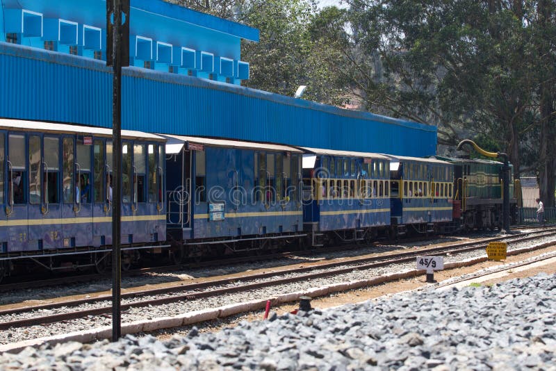 OOTY, TAMIL NADU, INDIA, 22 March 2015 : Nilgiri mountain railway. Blue train. Unesco heritage. Narrow-gauge. OOTY, TAMIL NADU, INDIA, 22 March 2015 : Nilgiri stock images OOTY, TAMIL NADU, INDIA, 22 March 2015 : Nilgiri mountain railway. Blue train. Unesco heritage. Narrow-gauge. OOTY, TAMIL NADU, INDIA, 22 March 2015 : Nilgiri stock images